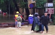 Civilians Wade Through Waterlogged Streets of Hoi An's Ancient Town