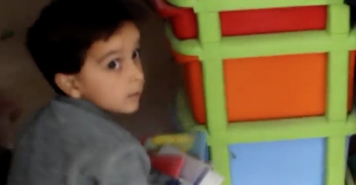 Children Collect Books at School Hit by Airstrikes in East Damascus