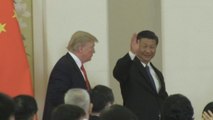 Trump departs China after visit marked by friendlier rhetoric