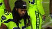 Seattle Seahawks cornerback Richard Sherman embraces quarterback Russell Wilson on sideline after going out with injury
