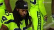 Seattle Seahawks cornerback Richard Sherman embraces quarterback Russell Wilson on sideline after going out with injury