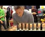 Most eggs in cups blown upside down in one minute - Guinness World Records