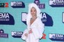 Rita Ora attends MTV EMAs red carpet in bathrobe