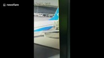 Flight attendant falls out of plane at China airport