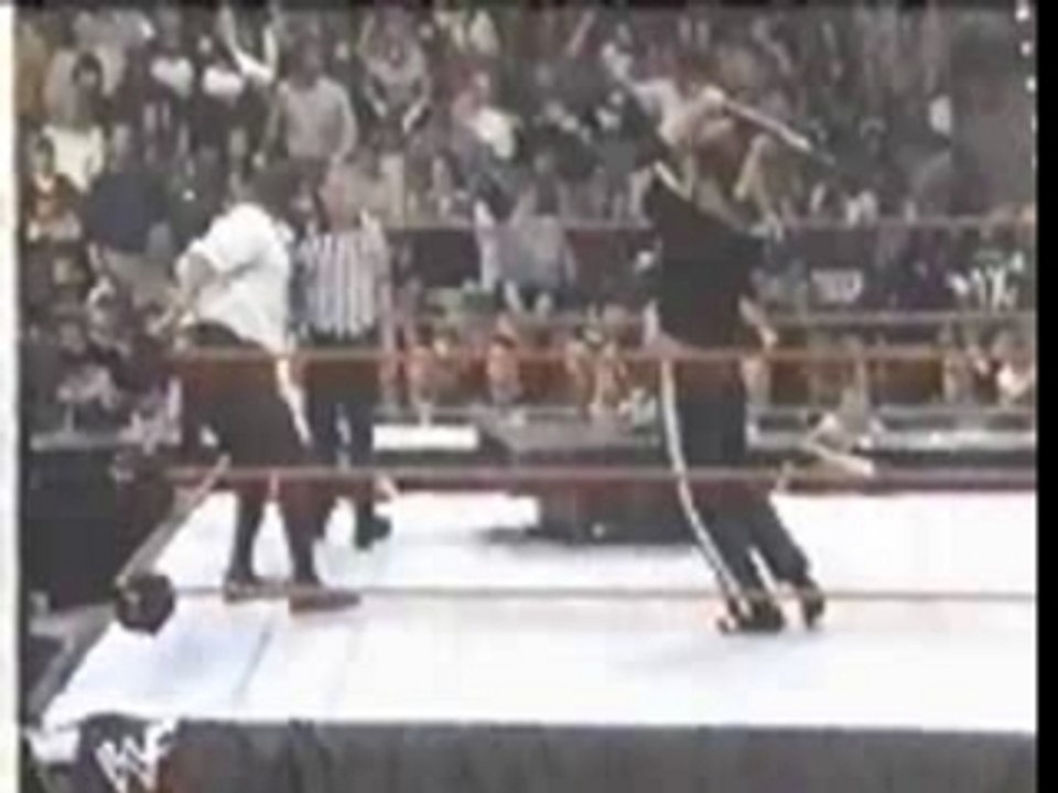 WWF The Rock hits himself with a chair