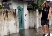Paddle Boarder Tours Flooded Streets of Bali