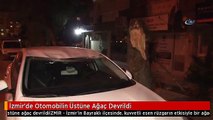 İzmir'de Otomobilin Üstüne Ağaç Devrildi