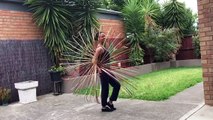 Woman Spins Multiple Hula Hoops