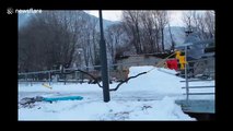 Skier lands VERY painfully during jump and slide stunt