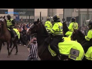 Newcastle fan punches police horse!