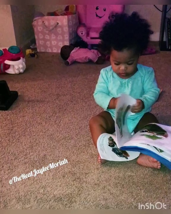 1 year old cutie determined to read!  #JayleeMoriah #BrainsAndBeauty
