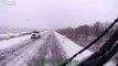 Car loses control in the snow crashing into a truck as the truck crashes into a trailer of bricks