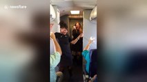 Flight attendants dance and sing during Southwest airlines flight