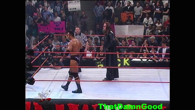 Kane returns to help The Rock & Undertaker fight off the McMahon-Helmsley Faction