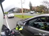 Woman texting while driving does not know shes being pulled over
