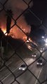 Fire Next to Highway Burns Palm Trees in Downtown Los Angeles