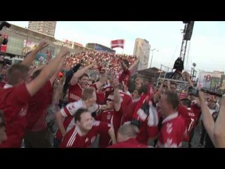Danish fans go wild in Warsaw fan park at final whistle after beating Holland 1-0
