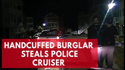 下载视频: Dashcam video shows handcuffed burglary suspect stealing police car