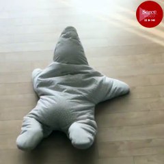 Yıldız şeklinde pijama giyen bebek