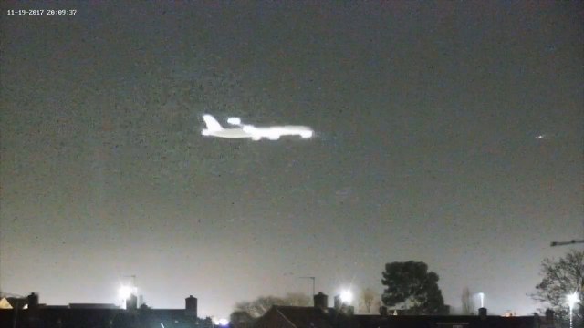 Mystery object flashes over Heathrow Airport sky moments before passenger jet makes landing