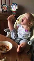 Baby with no hands eating