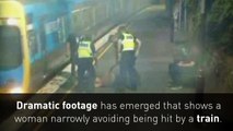 CCTV footage captures dramatic train track rescue