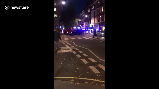 Ground shot of people running from London's Oxford Circus
