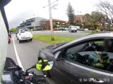 Woman texting whiledriving does not know shes being pulled over