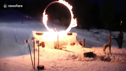 Skier does switch backflip through flames