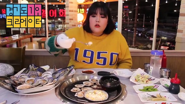 The girls eat clams, grilled oysters