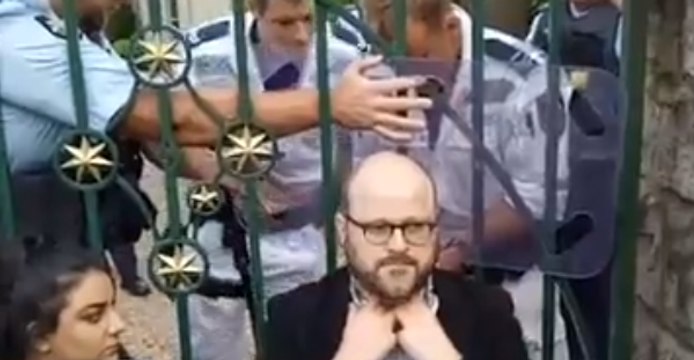 Police Remove Immigration Activists Chained to Gate of Australia PM's Residence