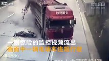 Scooter pulls out and stops in traffic causing the dump truck to flip over