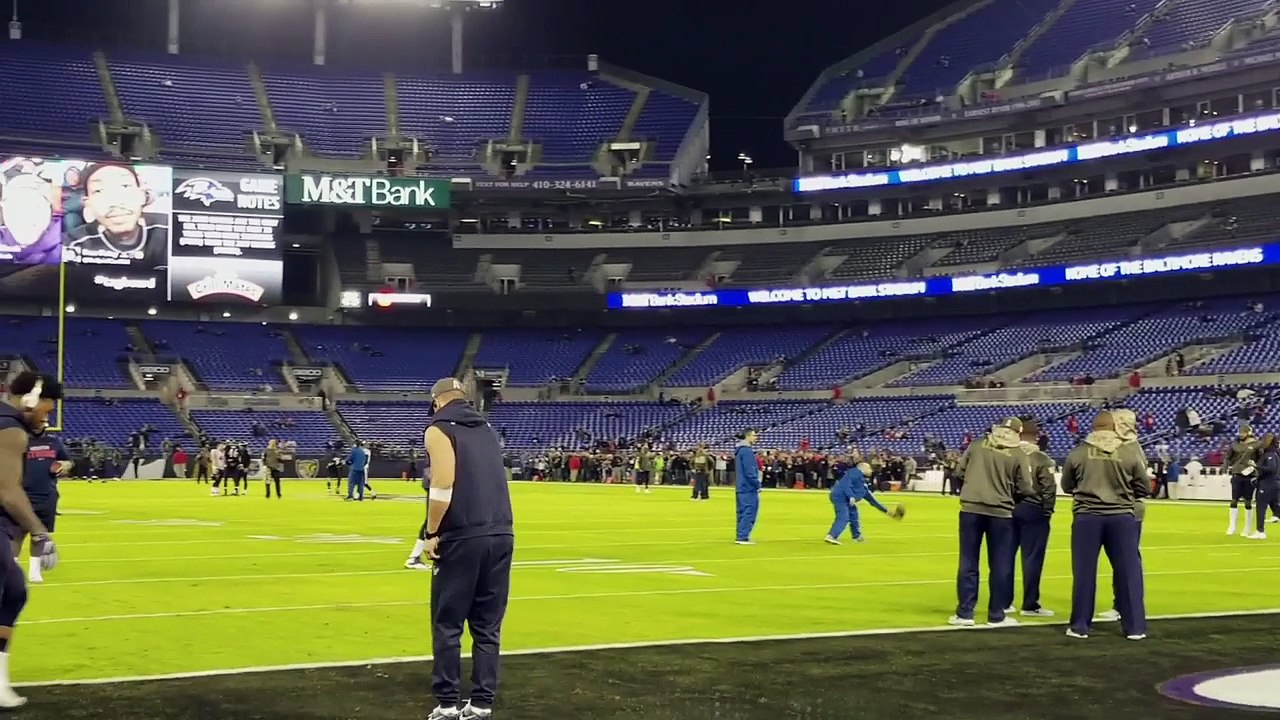 Houston Texans players play baseball during warmups