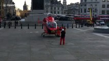 Air Ambulance helicopter lands in London's Trafalgar Square