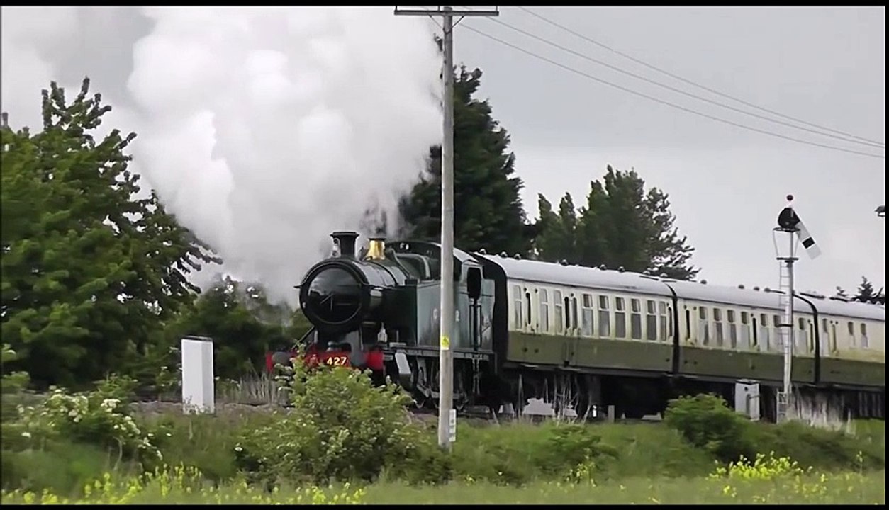 Steam Train English Tank Engine puffing along with 6 Coaches