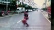 Woman crossing road narrowly escapes being run over by lorry