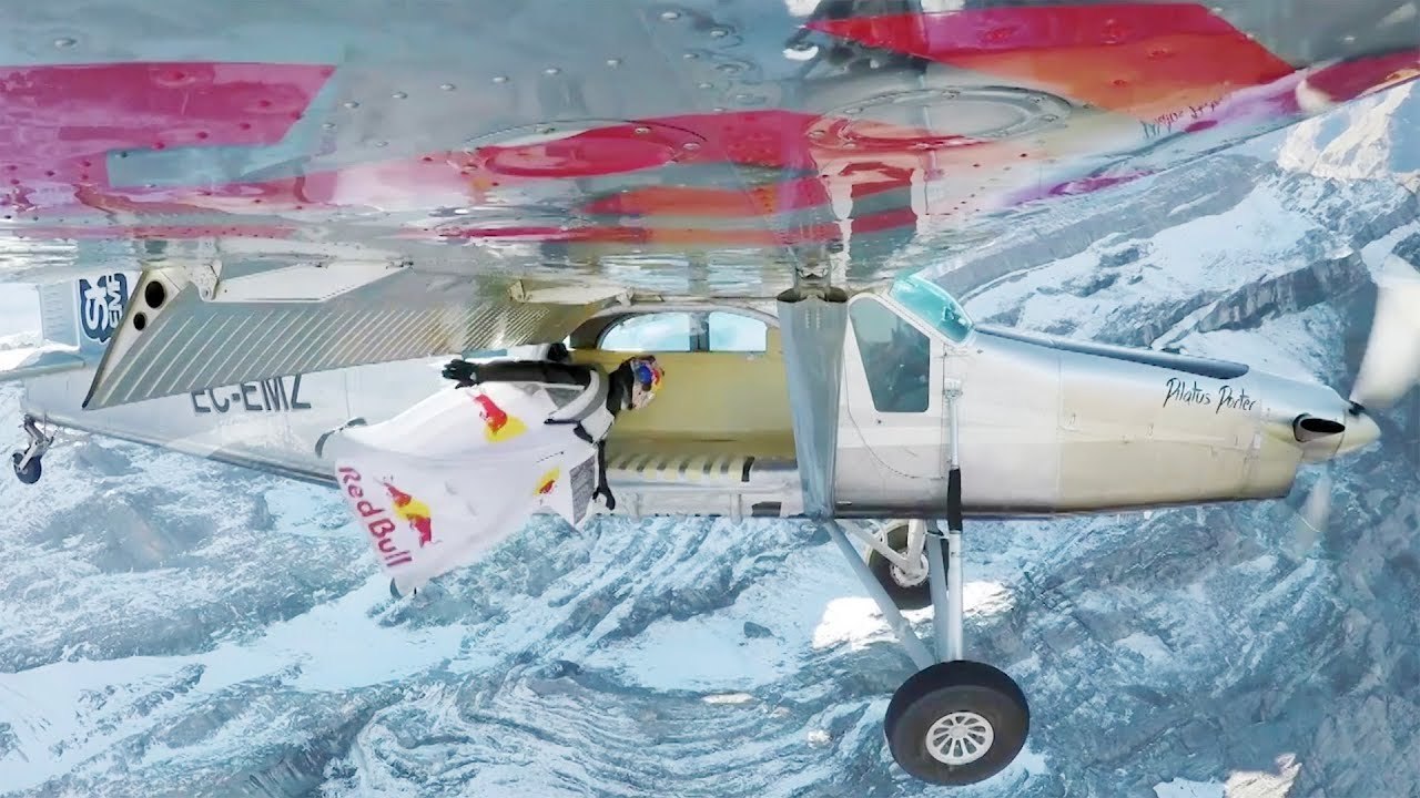 2 wingsuit flyers BASE jump into a plane in mid-air. | A Door In The Sky