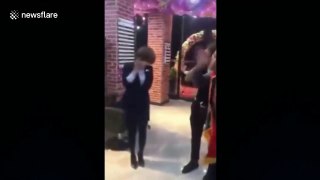 Management makes hair salon workers stand in circle and slap themselves