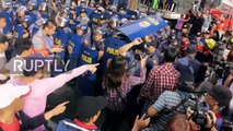 Philippines: Anti-Duterte protesters clash with riot police in Manila