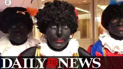 Men in blackface invade a school for racist Black Pete