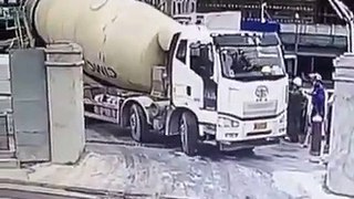 Cement truck falls down in a big hole