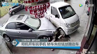 Driver using their cellphone crashes into a building