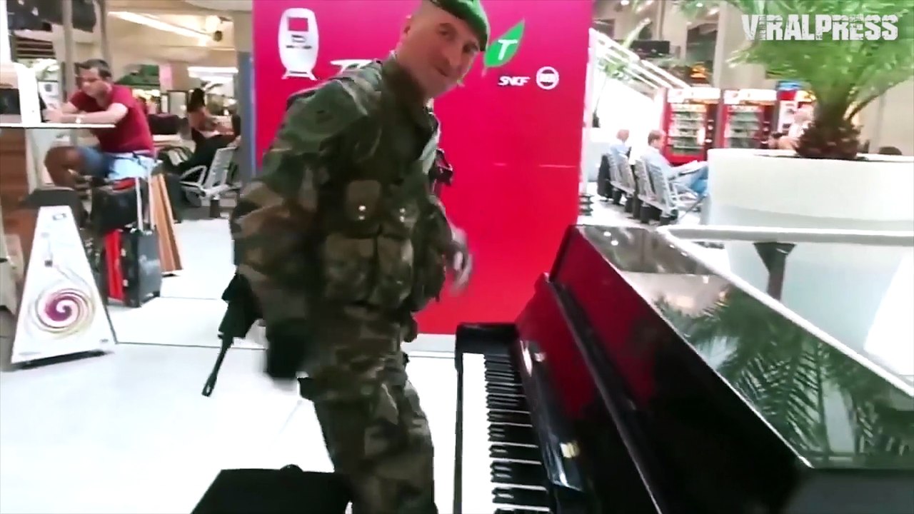 French Soldier Plays Piano And Sings At Train Station