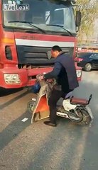 Biker keeps hitting  truck with head