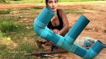 Creative girl make fish trap with PVC plastic pipes to catch a lot of fish in Cambodia