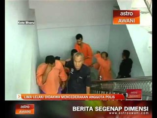 5 lelaki didakwa mencederakan anggota polis