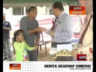 Mangsa kebakaran berpakaian biasa ke sekolah