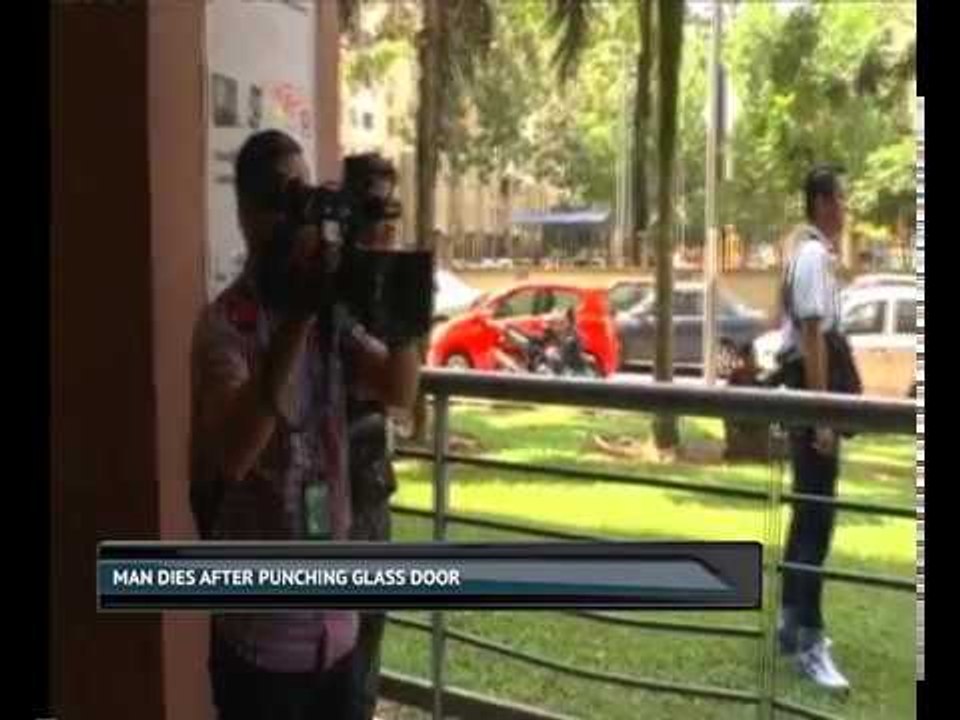 Man dies after punching glass door