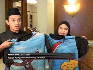 Waris abadikan lukisan mangsa dalam bentuk kemeja-T