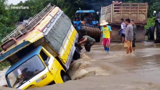 Bus washed off road after flash flood in Thailand
